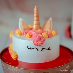 The star of the show. This unicorn cake, with its golden horn and pastel frosting, is almost too pretty to eat. It's a key part of our cake smash session.