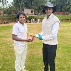 A young player receives a trophy for his contribution to a thrilling win in the RRCC U-14 Tournament.