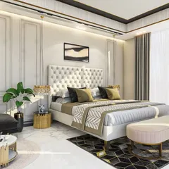 An elegant bedroom design featuring classic wall mouldings and a tufted, button-back headboard. The color palette is a sophisticated mix of cream, gold, and charcoal, creating a serene and luxurious atmosphere.