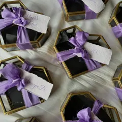 I had the pleasure of engraving these stunning heart-shaped glass boxes. Each box was personalized with an initial and a tiny heart, finished with a handwritten name tag and a delicate purple silk ribbon.