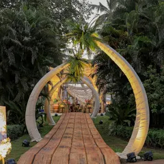 For a truly immersive escape, I designed this Bora Bora themed entrance. Guests journey through illuminated palm arches and along a rustic wooden pathway, immediately transported to a tropical paradise where every detail whispers of exotic elegance and celebration.