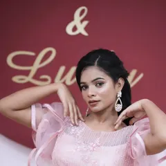 A beautiful shot from a portfolio session. The model's soft, romantic look is enhanced by the elegant hairstyle and dreamy lighting.