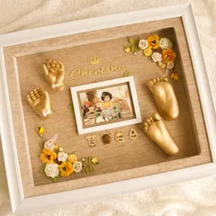 Here is a beautiful example of what you can create. This custom frame features golden hand and foot casts, a baby photo, and personalized details like the name and birth stats. I teach you how to arrange these elements to create a balanced and sentimental keepsake.