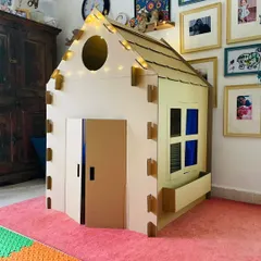 See how our large playhouse fits perfectly into a child's room. Before the paint, it's a sturdy, eco-friendly fort, reading nook, or secret clubhouse, ready for adventure.