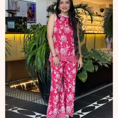 This vibrant pink floral co-ord set is all about having fun with your style. The flared pants and matching top are both comfortable and eye-catching.