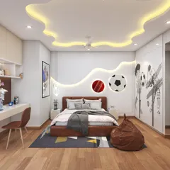 A dreamy and spacious bedroom for a child. The design is playful yet sophisticated, with a sports theme on the wardrobe and a unique cloud-shaped false ceiling design. The room has plenty of space for play.