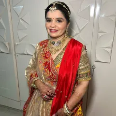 A smiling portrait of the mother of the bride. Her makeup is radiant and timeless, ensuring she looks and feels her best on her daughter's special day.
