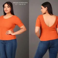 A front and back view of a plus-size model wearing an orange scoop-back top and jeans, providing a complete look for e-commerce.