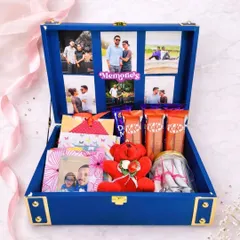I love putting together these memory trunk hampers. This one, in a beautiful royal blue, has a photo collage inside the lid and is filled with chocolates, a teddy bear, and other little surprises you can customize.
