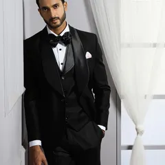 This three-piece tuxedo demonstrates our dedication to layered elegance. The coordinating waistcoat adds depth and formality, ensuring a polished look from every angle.