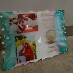 Another angle of the resin wedding card, showing the shimmer in the resin and the delicate details.