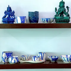 My new ceramic pieces, finding their place on the shelf next to other art that inspires me. The blue and white glaze patterns were a joy to experiment with.
