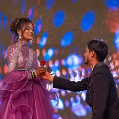 A sweet moment during the sangeet where the groom presents a rose to his bride on stage. These are the romantic highlights that make the celebration memorable.