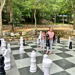 Two young guests make their move on our giant outdoor chessboard. It's a fun, oversized version of the classic strategy game that brings play to a whole new level.