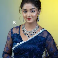 Dolled up the lead of 'Lakshmi Baaramma', Bhoomika Ramesh, for the Anubhanda Awards. This glamorous look features a smokey eye and a radiant base, ensuring she looked stunning on the red carpet.
