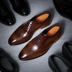Capturing the essence of luxury. For these premium leather brogues, I used specific lighting techniques to highlight the rich texture of the leather and the fine details of the craftsmanship, creating a classic, high-end commercial photograph.
