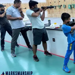 Shooters of all ages participate in the Marksmanship Summit held at our academy. This image captures the intensity and focus of competitors during the open sight rifle competition.
