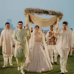 A grand bridal entry. We designed this beautiful phoolon ki chadar with delicate baby's breath and white flowers, creating a heavenly canopy for the bride's walk down the aisle.