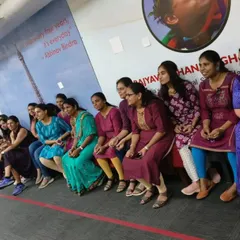 Participants waiting for their turn, sharing a moment of camaraderie during the corporate team-building event.