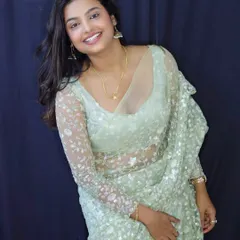 Influencer Sonu Srinivas Gowda looking elegant in a modern, lightweight mint green saree with sequin work. This type of designer saree is perfect for receptions and evening parties.
