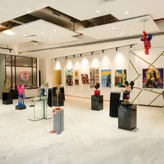 Our gallery is a stage where reimagined classics and modern pop icons coexist. This perspective captures the diverse range of art we exhibit, from paintings that challenge tradition to sculptures that celebrate contemporary culture.