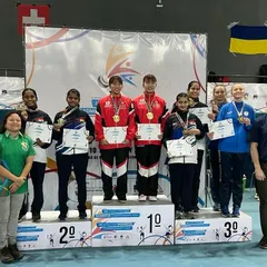 **Podium Finish at the World Championship.** Aaditya Yadav on the podium for the Junior Women's Doubles event at the 3rd Junior World Deaf Badminton Championship, securing a silver medal for India.
