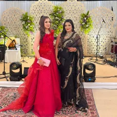 The happy couple at their 10th-anniversary celebration, with our elegant stage decor in the background. We love creating beautiful settings for our clients' milestone moments.