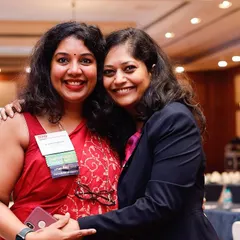 Sharing a happy moment with a friend and colleague at a BNI event. The relationships built within this network go beyond just business.