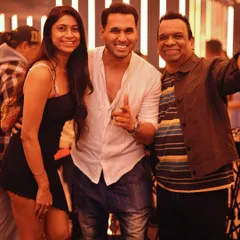 Posing with some happy partygoers. It's always great to connect with the people who come to my shows.