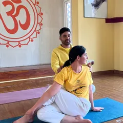 We believe in proper alignment to ensure a safe and effective practice. Our instructors provide personal, hands-on adjustments, helping you deepen your understanding of each asana, like this Ardha Matsyendrasana (Half Spinal Twist).