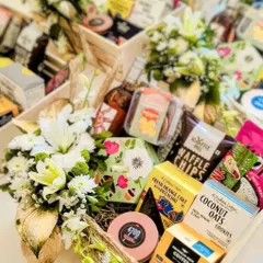 A gift given with love is the most precious thing. These gourmet hampers are overflowing with delicious goodies and fresh white florals, ready to be delivered and delight.