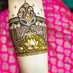 A close-up of a beautiful 3D arm band, featuring a lotus motif with a stunning raised effect.
