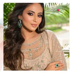 The perfect pairing of statement earrings and a cocktail ring. This emerald and diamond set is designed for the bride who wants to make a chic and memorable statement at her reception.