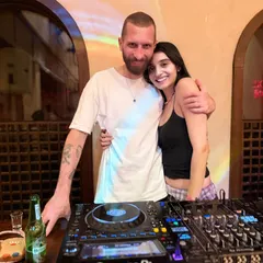 A happy moment with a fellow DJ after a great B2B set. The best collaborations come from mutual respect and a shared love for the music.
