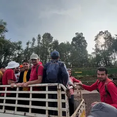Part of the adventure is the journey itself. Here, the team travels by a local jeep, adding an element of rustic charm to their Bandaje waterfall expedition.