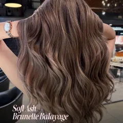 A Soft Ash Brunette Balayage offers a subtle, low-contrast look. This technique adds dimension without a drastic change, perfect for a sophisticated and modern update.