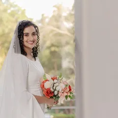 Another shot of our stunning curly bride. It's empowering to wear your hair naturally and elegantly for life's biggest moments.