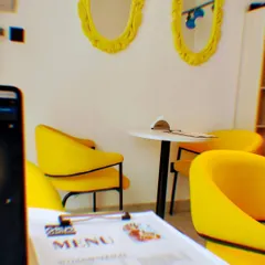 Welcome to our happy place in Sector 132. We designed our cafe with these bright, comfy chairs and cozy corners so you have the perfect spot to work, chat with friends, or just enjoy your meal.