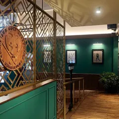 Detail is everything in lighting design. At the KGA bar, I used focused spotlights to catch the texture of the brass decorative screen and highlight the club's emblem, turning architectural elements into key visual features.