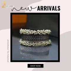 A close-up of my ghungroo bangle, featuring an oxidized silver band adorned with clusters of small pearls. This piece makes a beautiful sound with every movement.