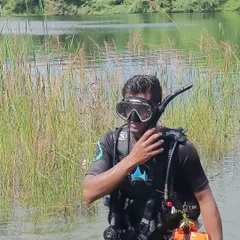 A final check of my mask and snorkel before heading into the water. Proper gear fit and function is a critical part of my pre-dive safety routine, a habit I instill in every diver I train.