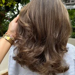A close-up of the color refresh, showing the beautiful blend of tones and the healthy shine after styling.