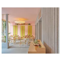 We used locally mined Sadaralli granite for the floors and walls in the outdoor area. This durable, textured stone provides a neutral base that balances the bright colors used throughout the rest of the restaurant.