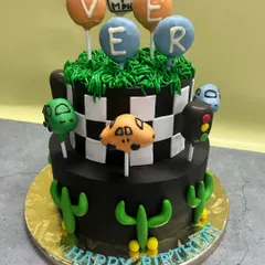 A fun, car-themed birthday cake perfect for a little one's celebration. I used cake pops as toppers to create a playful and unique design.