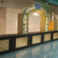 A closer look at the decorative arch for our main course counter at a wedding. The elegant design and lighting make the food display look even more special for the 950 guests we served.
