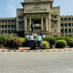 Standing proudly in front of the completed landscaping work at one of Bangalore's most iconic buildings. It is a privilege to contribute to the beauty of our public spaces.