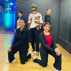 A smaller group from our Bollywood class posing for a picture. Every class is a chance to learn and grow together.