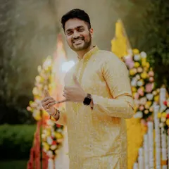 The groom looking cool and happy at his Haldi ceremony, giving a shaka sign to the camera.