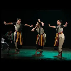 A dynamic scene from the 'Ikshana' stage performance. This highlights the ensemble choreography, where each dancer contributes to a larger, unfolding story about our planet's struggle and resilience.
