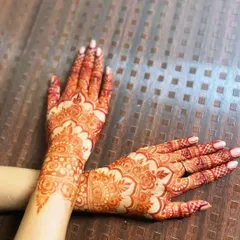 A stunning, bright reddish-orange henna stain, showcasing the beautiful color achieved with my organic paste.